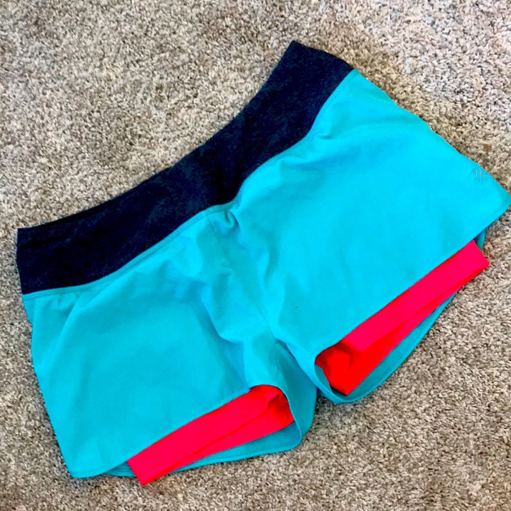 MPG running shorts bright teal and pink size medium